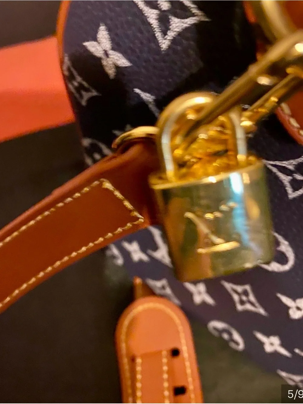 NOT AUTHENTIC Louis Vuitton Navy Monogram Satchel with Brown Leather Trim.